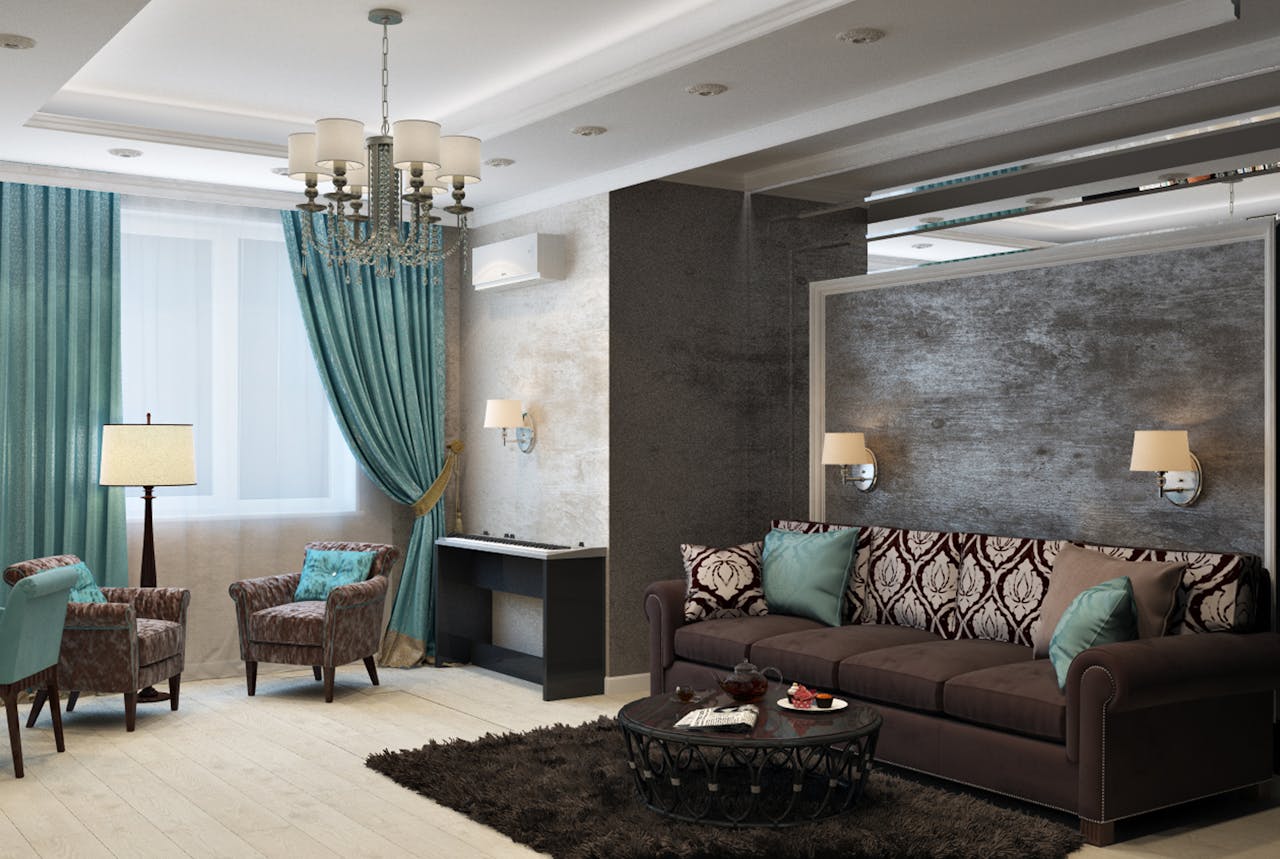 who-we-are Luxurious modern living room with chandelier, sofa, armchairs, and stylish decor.